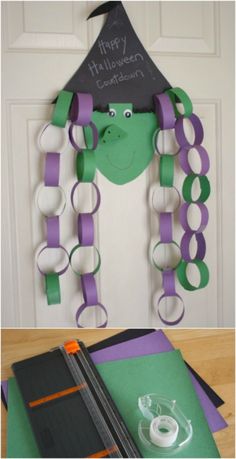 a door decorated with purple and green paper chains, a witch's hat on top