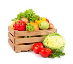 a wooden crate filled with lots of different types of fruits and vegetables next to lettuce