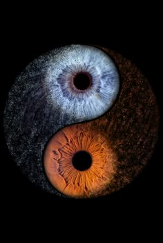 an eyeball is shown in the shape of a yin - yang symbol on a black background