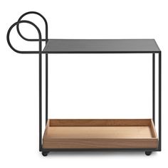 a black table with a wooden tray on it and a metal frame around the top