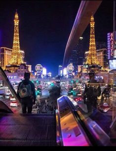 an escalator going up to the eiffel tower in paris at night