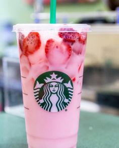 a starbucks drink with strawberries and ice