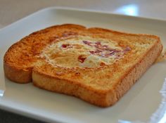 two pieces of toast on a white plate