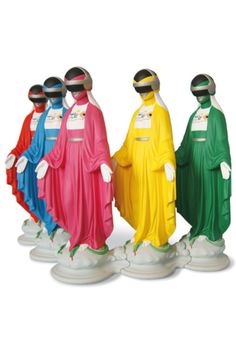 four statues of people in colorful robes