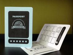 a passport sitting on top of a table next to a computer keyboard and mouse pad