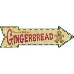 a sign that says fresh baked gingerbread with a teddy bear on the bottom and an arrow pointing to it