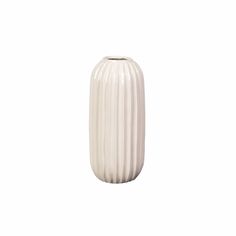 a white vase sitting on top of a table