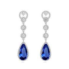 Elegant Sapphire Blue CZ Earrings These brilliant pierced earrings will add a glamorous touch to your wedding day. The unique 2" long design is plated in silver and is adorned with high quality clear crystals with sapphire blue teardrop glass crystals. A striking accessory for your wedding, quinceanera or any special occasion. Size: about 2" long and .4" wide at the widest point. Color: Silver/ Sapphire Blue /Clear. Style: E7301. Please allow 2 weeks for delivery. Shipping Policy . Return Policy Bridal Earrings Statement, Formal Earrings, Crystal Bridal Earrings, Bridesmaid Pearls, Bridal Accessories Jewelry, Bridal Earrings Drop, Pearl Jewelry Wedding, Gold Headband, Blue Bridal