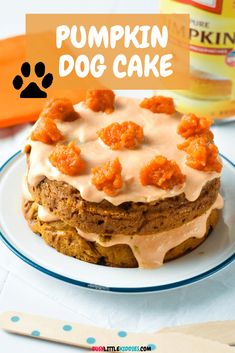 pumpkin dog cake on a plate with frosting