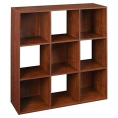 a wooden shelf unit with six compartments on the front and four shelves on the back