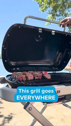 a person is grilling steaks on a bbq with the words, this grill goes everywhere