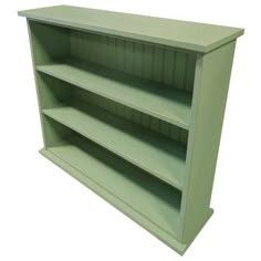 an empty green shelf with three shelves on each side and the bottom half painted dark green