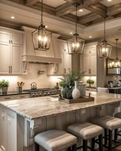 a large kitchen with an island in the middle and four stools at the end