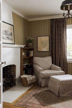 a living room with two chairs and a fireplace