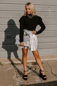 - Achieve trendsetter status with this glamorous pleated skirt!
 - Unlined, pleated metallic material 
 - A waistline with side zip closure
 - A figure flattering silhouette that ends in a pleated mini skirt length hemline October Feels, Pleated Mini Skirt, Skirt Length, Trend Setter, Pleated Skirt, Side Zip, Mini Skirt, Mini Skirts, Skirt