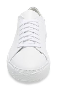 Handcrafted from fine calfskin, this clean-cut sneaker offers impeccable style in a sporty silhouette. Lace-up style Removable cushioned insole Handcrafted Leather upper and lining/rubber sole Made in Portugal