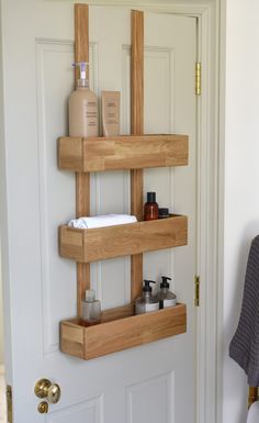 a wooden shelf with soaps, lotion and other personal care items on it