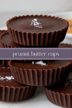 chocolate peanut butter cups stacked on top of each other with powdered sugar in the middle