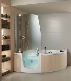 a bathroom with a large tub and shelves on the wall, along with a wooden table