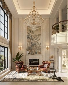 an elegant living room with chandelier and couches