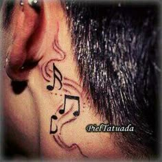 a man with music notes behind his ear and behind the ear is a musical note