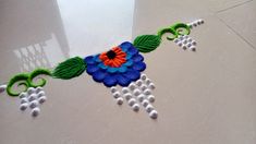 this is an image of a flower made out of beads