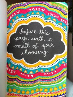 a colorful notebook with a quote written on it