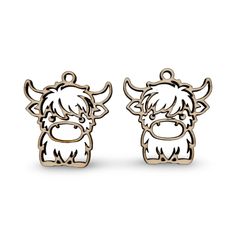 pair of earrings with an image of a bull on the front and back of each ear