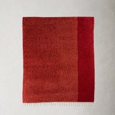 a red rug with two different colors on it