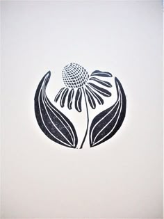 a drawing of a flower with two leaves on it's back side, in black and white