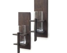 two wooden shelves with glass holders on them