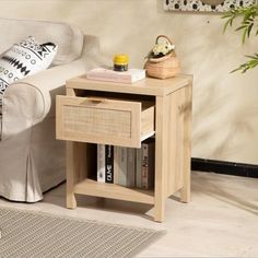 a living room with a white couch and a wooden end table next to a sofa