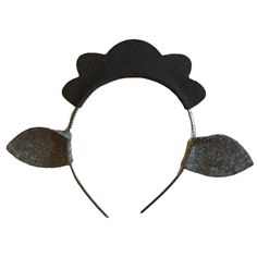 a black headband with two leaves on it