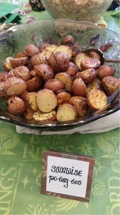 there is a bowl full of potatoes on the table with a sign that says siamise too easy to use