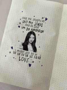 a notebook with an image of a woman's face and words on the pages