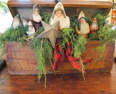 an old wooden box filled with christmas decorations