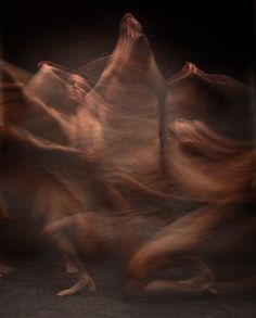 blurry photograph of dancers in motion on the floor