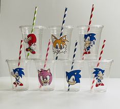 six sonic the hedgehog cups with different colored straws