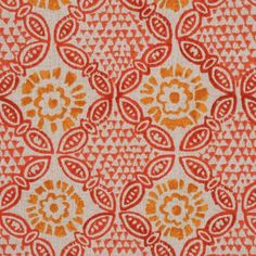 an orange and white pattern on fabric