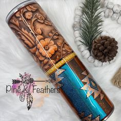 thermos is next to pine cones and other items on a white furnishing