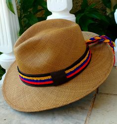 - Authentic Panama Hat     with Removable Band - This panama Hat is naturally coloured in a Brown Coffee Tint  ~ A Removable Hat Band Included with Ecuadorian Flag Colour ~ ~ Genuine Panama hat handwoven with Toquilla palm ~ ~ Handwoven in Ecuador~  ~ Coffee Brown ~ ~ Instructions included ~ ~ Handmade adjustable band from size 53-63cm ~ Brown Woven Brimmed Panama Hat, Multicolor Wide Brim Panama Hat In Toquilla Straw, Brown Woven Travel Hat, Multicolor Wide Brim Hat For Travel, Multicolor Brimmed Panama Hat In Toquilla Straw, Brown Woven Panama Hat For Travel, Country Style Brown Woven Panama Hat, Multicolor Short Brim Hat For Travel, Multicolor Brimmed Hat For Travel