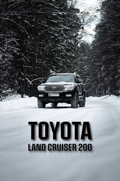 the toyota land cruiser 200 is driving on snow - covered road in front of trees