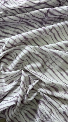 an image of a white and purple tie - dyed fabric that is very soft on the surface