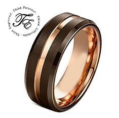 a wedding ring with two tone gold and black inlays on the inside of it