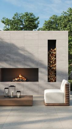 a living room with a fire place next to a couch and table in front of it