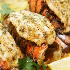 grilled lobster with lemon wedges and parsley