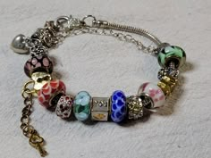 Colorful Glass and Metal Beaded Charm Bracelet Large Hole Beads w Safety Chain | eBay Crochet Charm Bracelet, Large Glass Bead Bracelet, Messy Bracelet, Eclectic Bracelets, 1990s Jewelry, Funky Bracelets, Bracelets Aesthetic, Funky Bracelet, Italian Bracelet