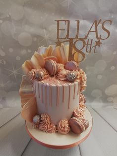 a birthday cake decorated with seashells and ribbons