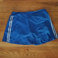 This Victoria's Secret Sport Tennis Skirt Comes With Built In Spandex Shorts. The Back Is Pleated For Extra Shape. Never Worn! Blue Sporty Swim Skirt With Built-in Shorts, Blue Swim Skirt With Built-in Shorts, Blue Stretch Swim Skirt Casual Style, Blue Stretch Casual Swim Skirt, Sporty Stretch Blue Swim Skirt, Casual Blue Stretch Swim Skirt, Blue Short Casual Swim Skirt, Sporty Blue Skort With Built-in Shorts, Blue Casual Short Swim Skirt