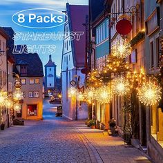 an image of a street that is decorated with christmas lights and garlands for the holiday season